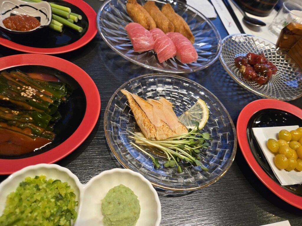 tuna nigiri and aburi torched sushi with wasabi spring onion