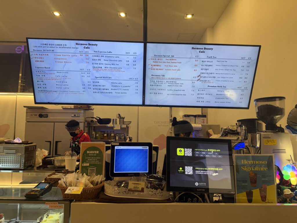 Royce Lotte World Mall cafe menu display with cakes and chocolates