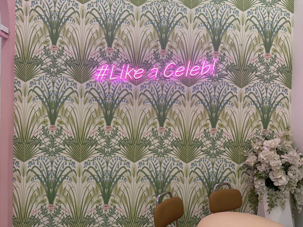 Warm interior with neon sign and modern cafe seating in Jamsil Seoul