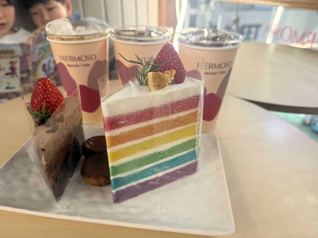 Close-up of chocolate desserts and refreshing iced drinks on a wooden table