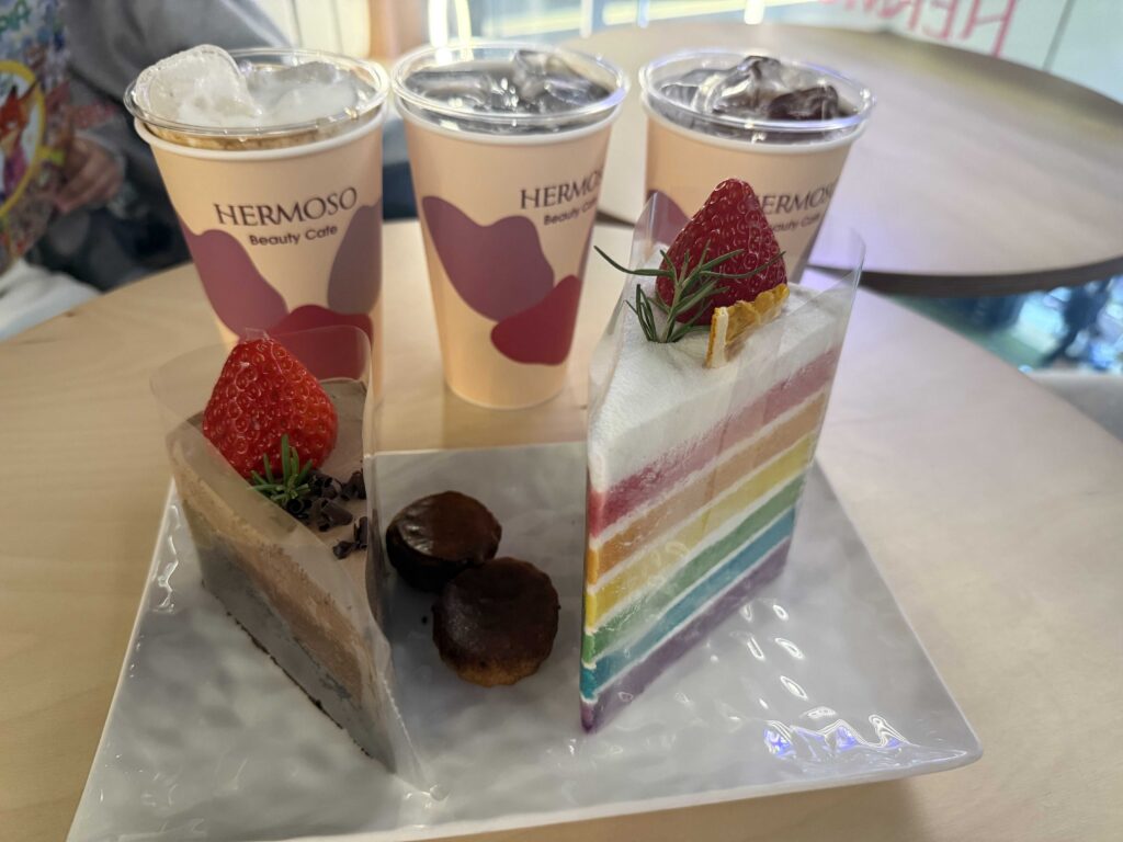 Full dessert spread with chocolate cakes and iced drinks at a Seoul cafe