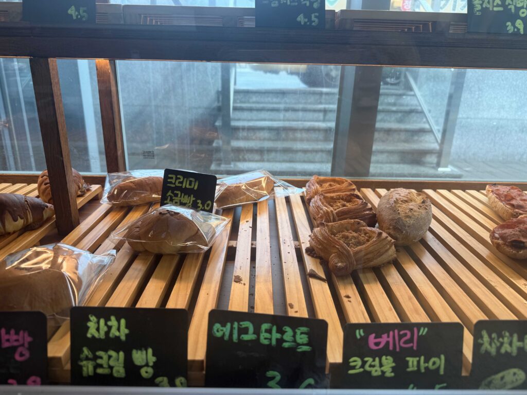 Salt bread croissants and egg tarts on display