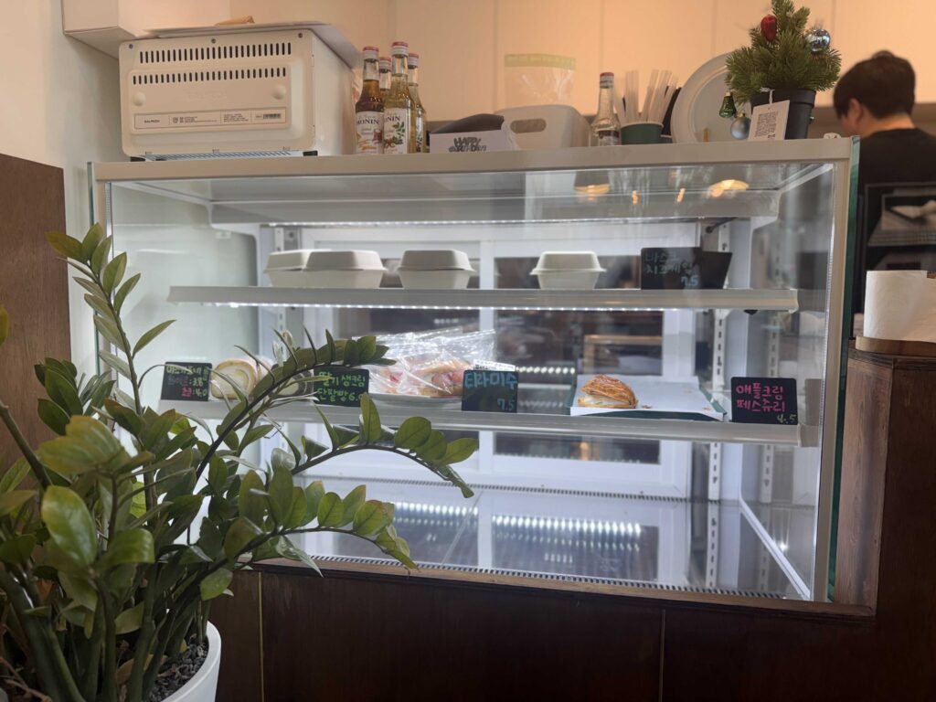 Refrigerated dessert display case with tiramisu and pastries