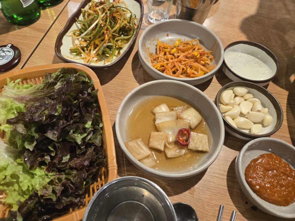 Fresh lettuce wraps with ssamjang dipping sauce garlic tofu and bean sprouts ready for Korean BBQ ssam