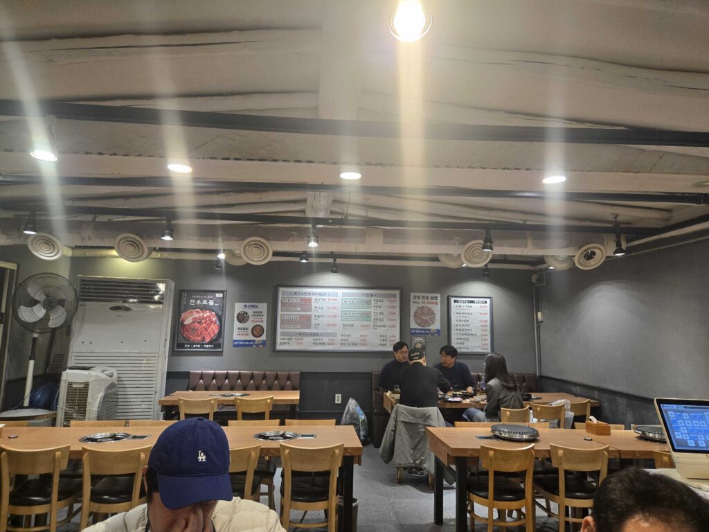 Fresh yukhoe Korean beef tartare with raw egg yolk pine nuts and pear slices at Mongttang Saenggogi Seongsu