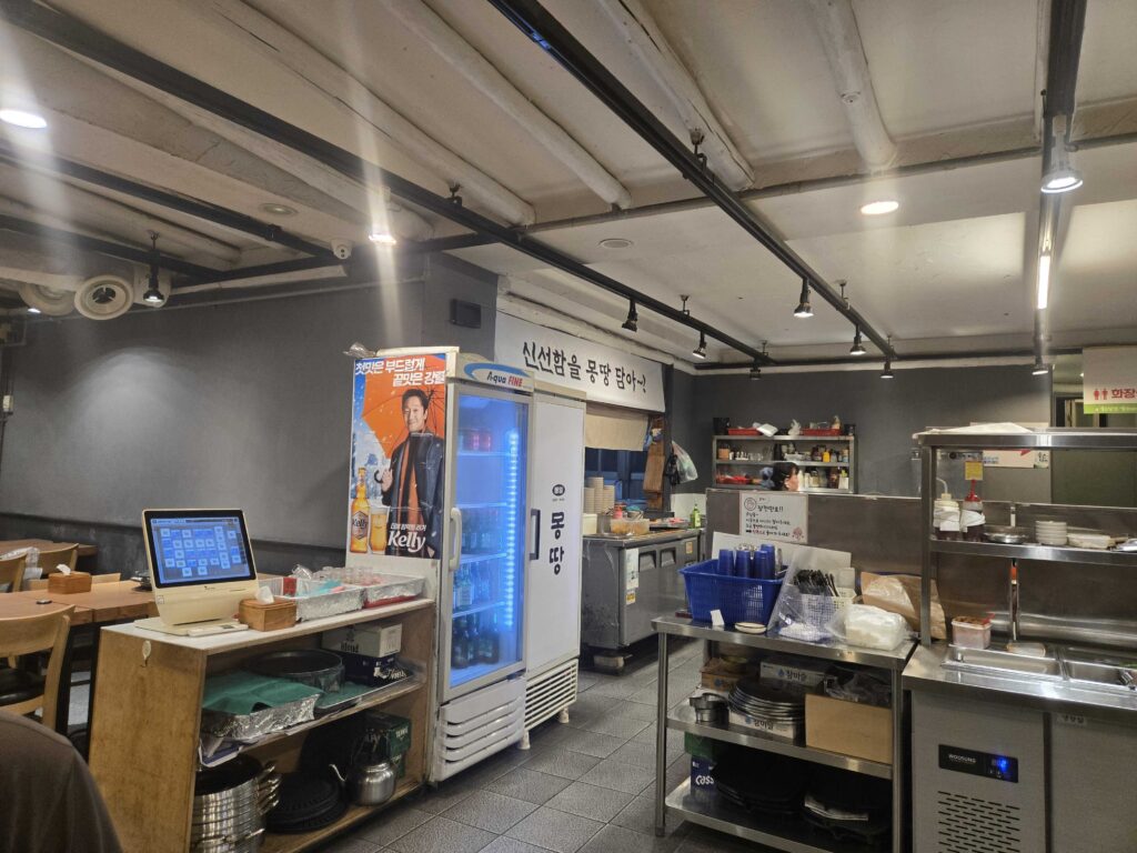 Mongttang Saenggogi Seongsu restaurant interior showing menu boards and industrial ceiling design