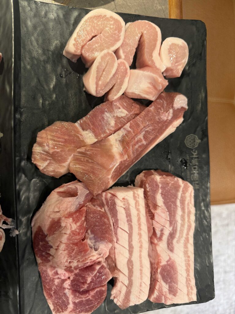 Fresh pork cuts close up at Geobugi Dongnae Korean BBQ