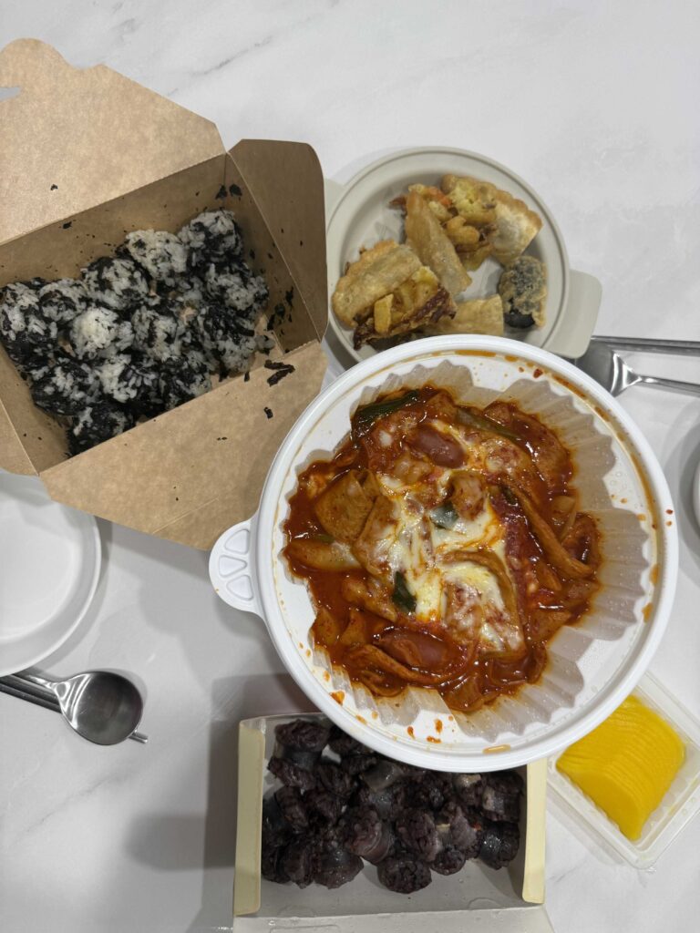 Yeopgi Tteokbokki chewy rice cakes close up mild spicy sauce Korean tteokbokki