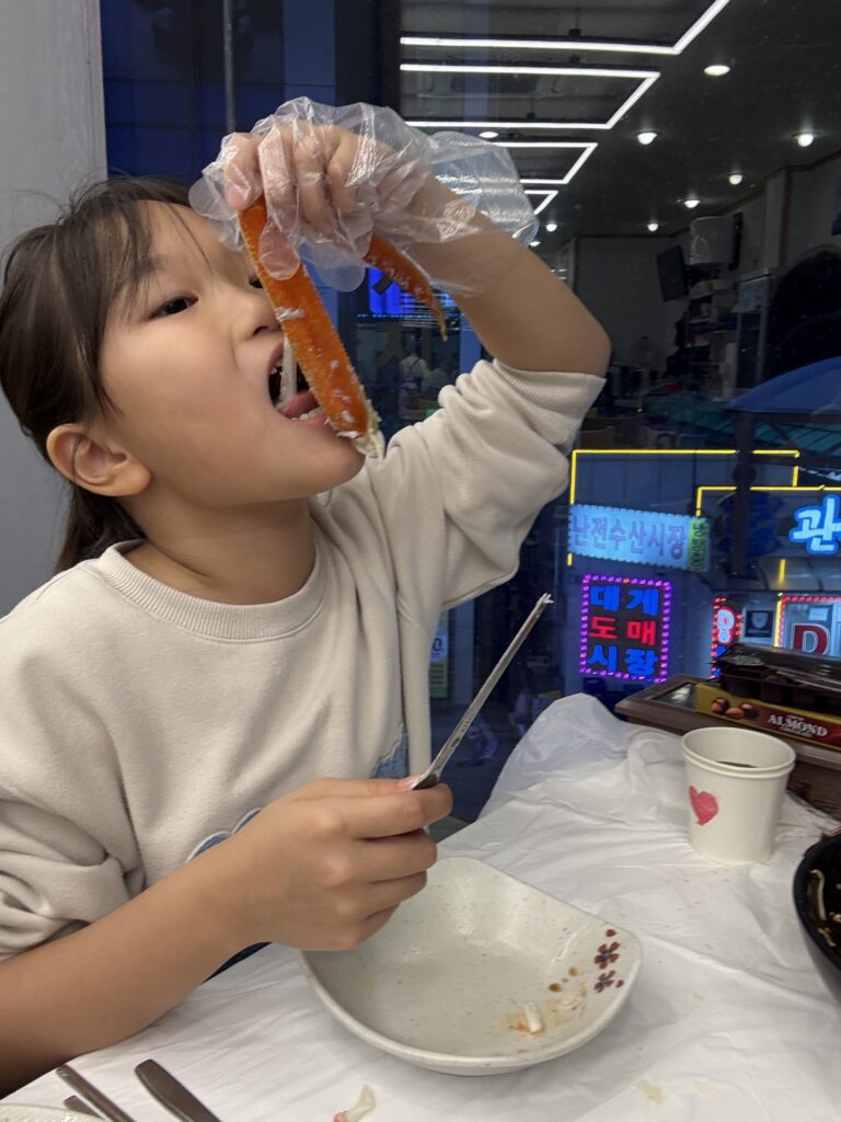Side dishes banchan at Meoguri Hoetjip including shrimp clams grilled fish