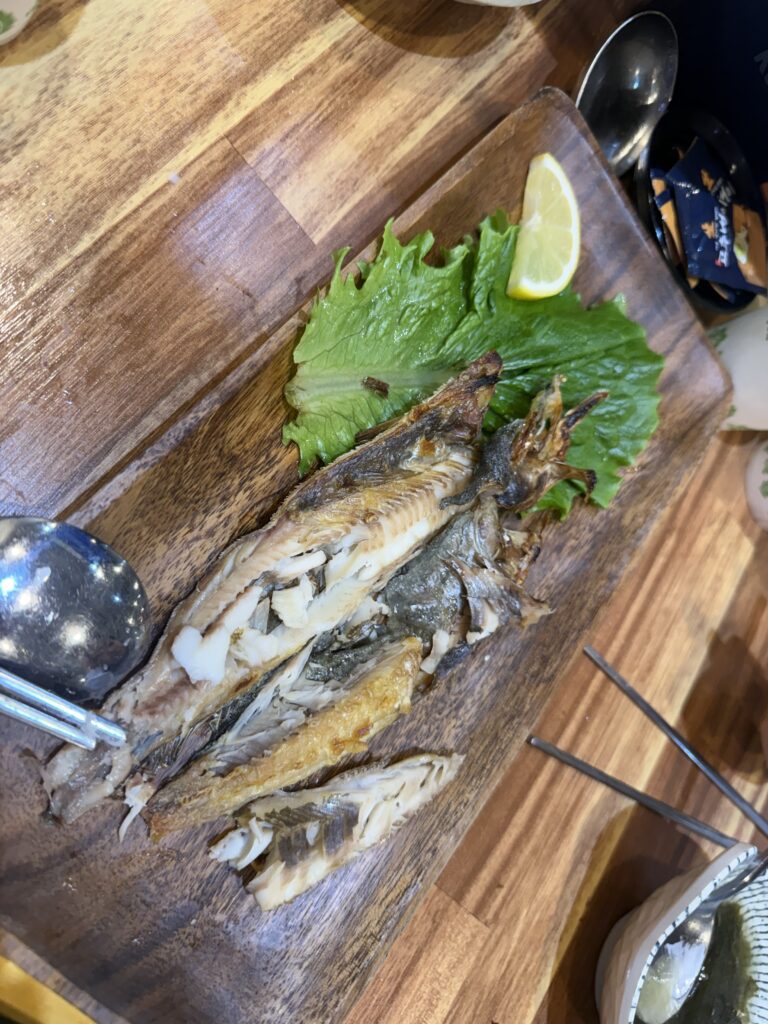 Grilled mackerel on a wooden board