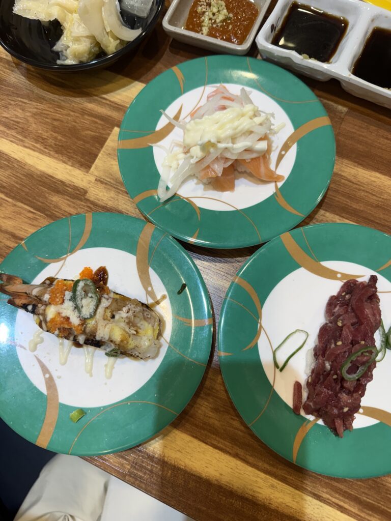 Sushi plates from the belt on our table