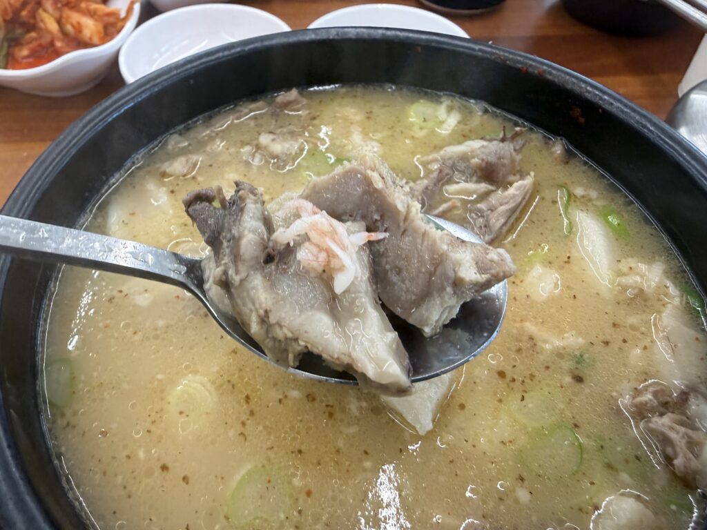 Child eating sundaeguk Dalbit-e Goeun restaurant Sokcho family meal