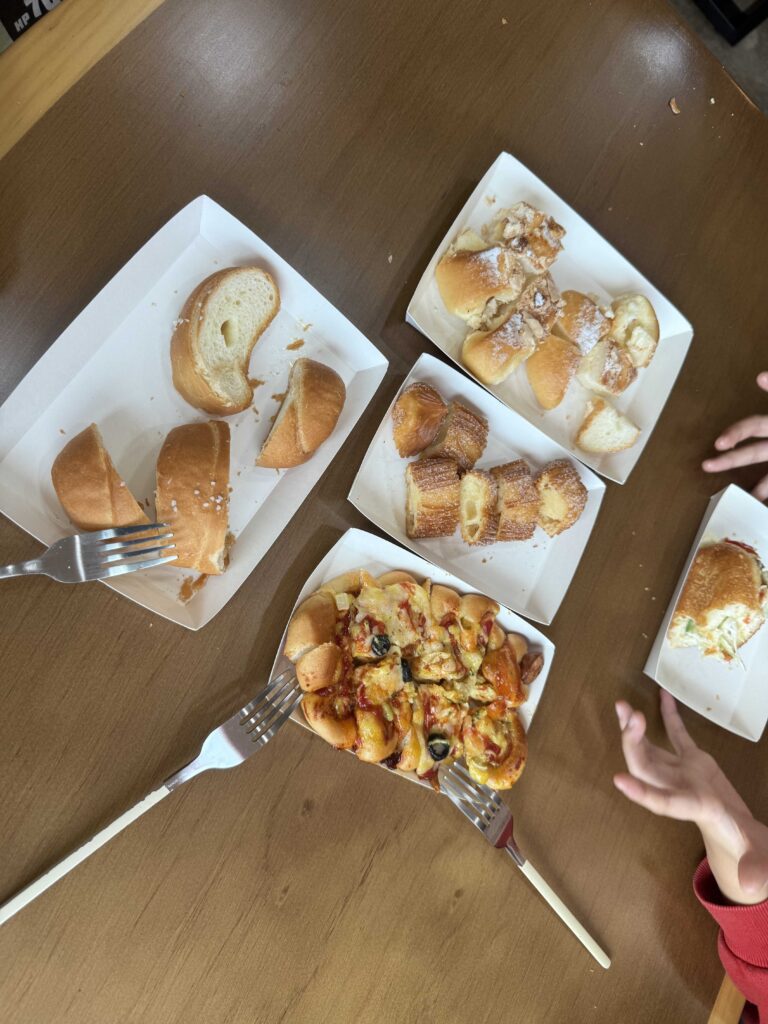 Eating Ganghyeon Bakery bread at table salt bread spread
