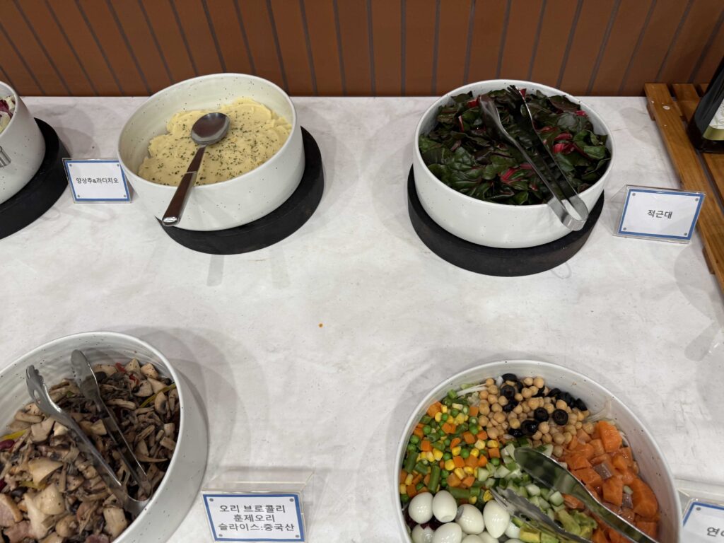 Salad station and fresh vegetables at Oak Valley Resort breakfast buffet