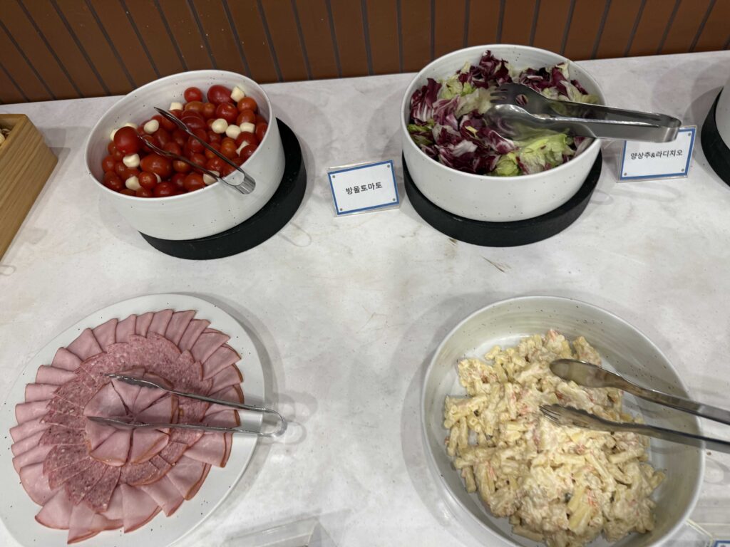 Cherry tomato salad and cold cut platter at Oak Valley Resort breakfast Wonju