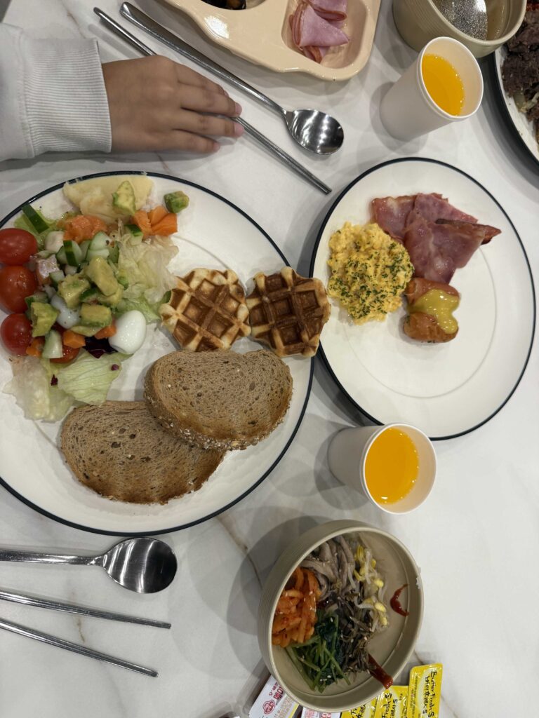Oak Valley Resort breakfast full plate with ham salad waffle banchan and juice
