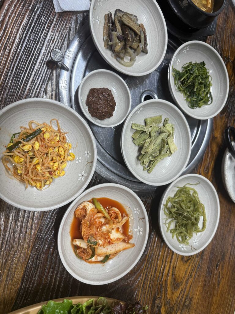 Full Korean dinner table spread with multiple dishes at Deulkkot Garden