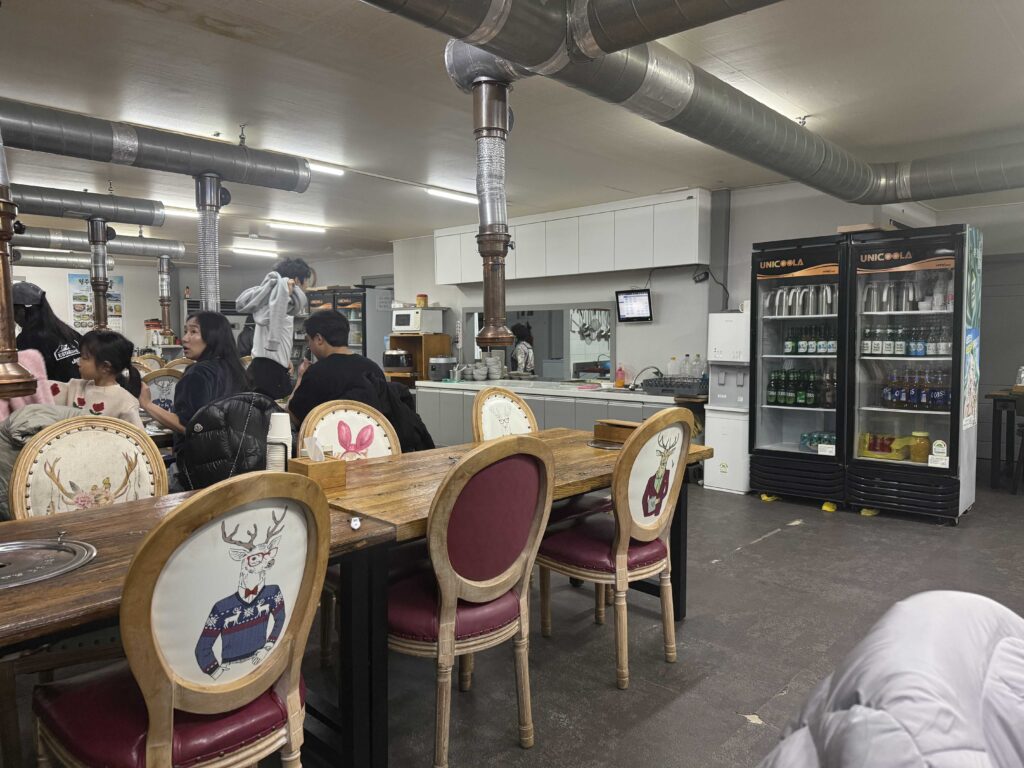 Korean restaurant interior wooden table traditional setting at Deulkkot Garden Wonju