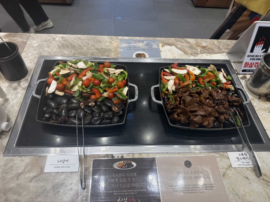 Full buffet spread side dishes and hot food at Shabeu 20 Seoul Korea