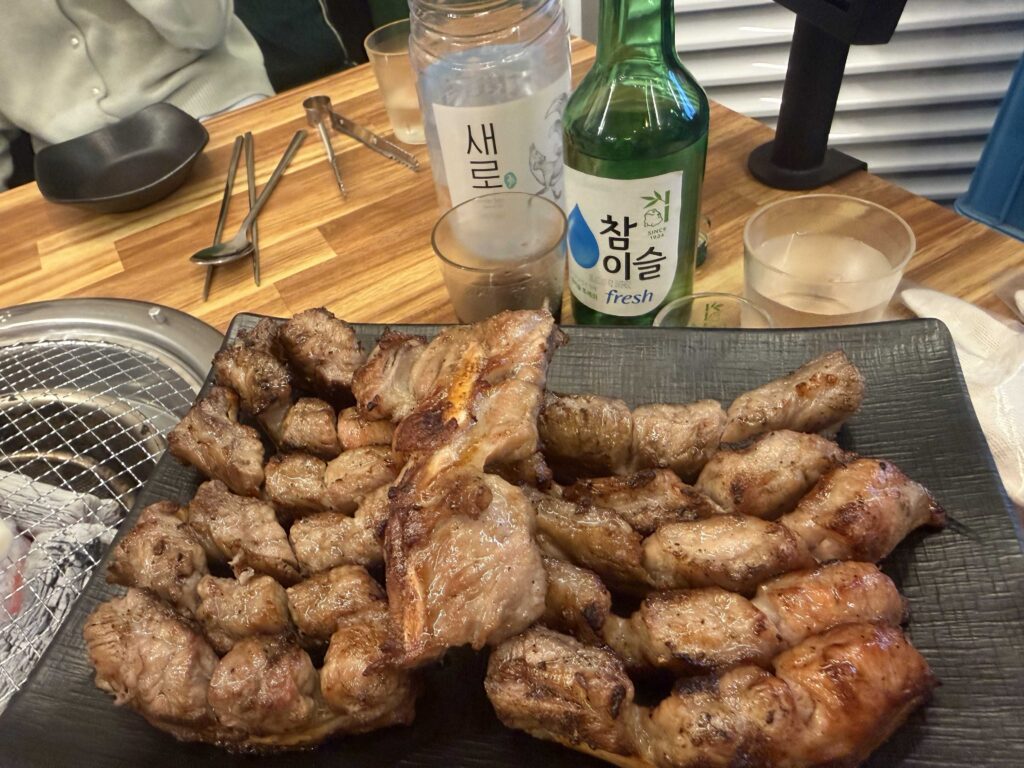 Full table spread of jjokgalbi ribs stew and sides at Jjokgalbi Gamil