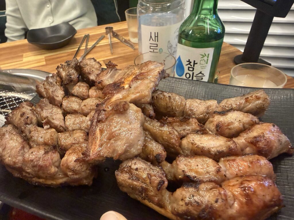 Close-up of perfectly charred Korean BBQ pork ribs on the grill