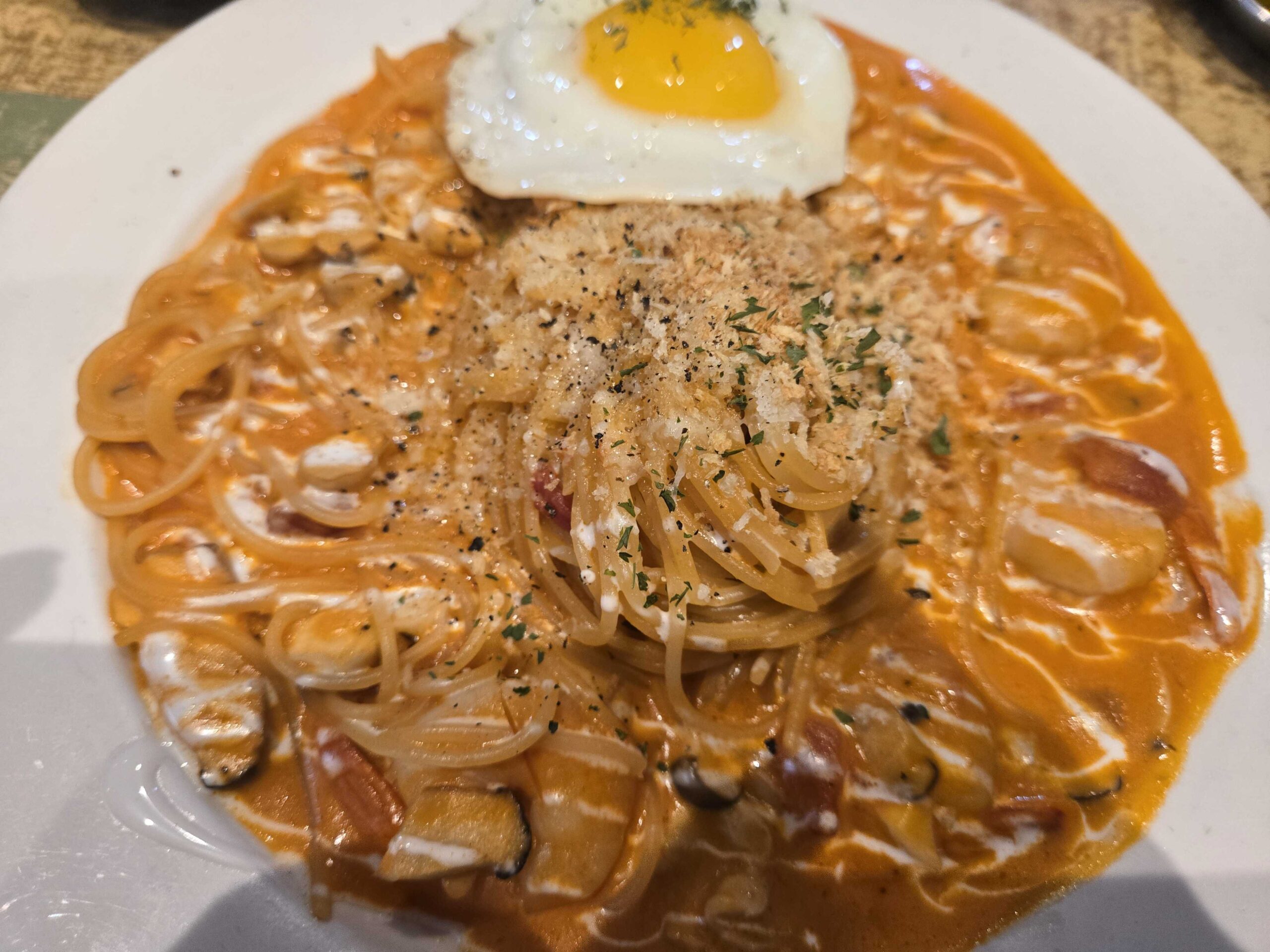 Pildong Hambak Rose Shrimp Pasta with fried egg and creamy orange rose sauce