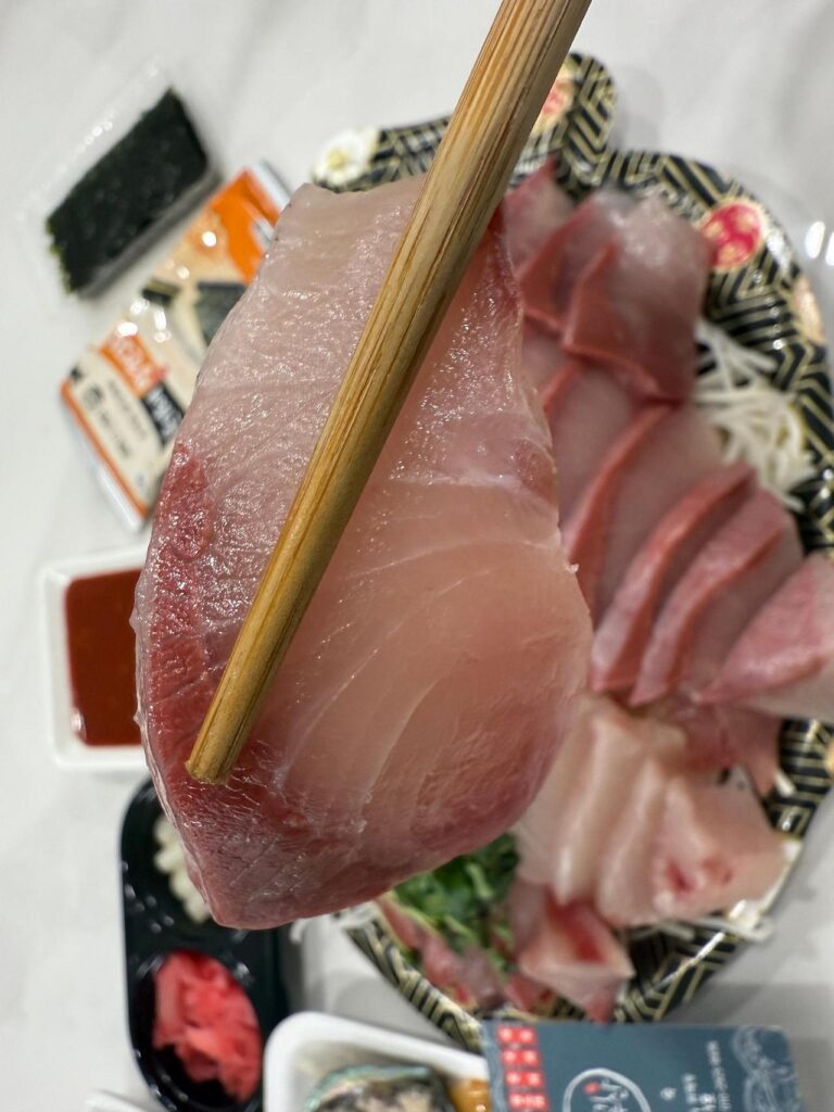 Thick cut fatty winter yellowtail sashimi dwaeji bangeo slices fresh raw fish Seoul