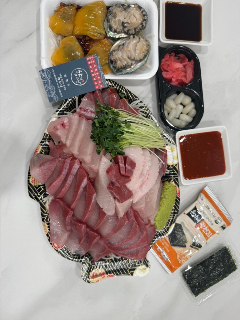 Fresh sashimi platter with side dishes Garak Market Raw Fish Center Seoul Korea