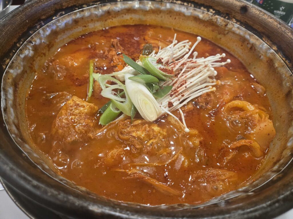 Close-up of spicy Korean jjigae stew at 502 Jjigae Maeul near Konkuk University Seoul