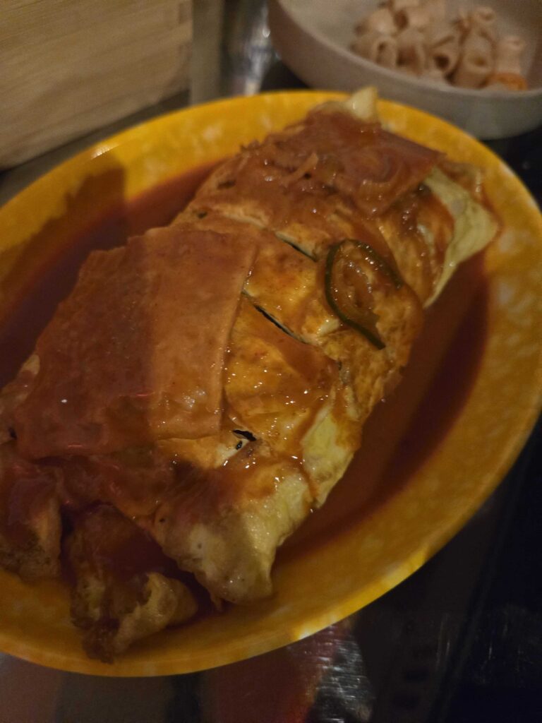 Egg roll kimbap plated and ready to eat at Korean pojangmacha