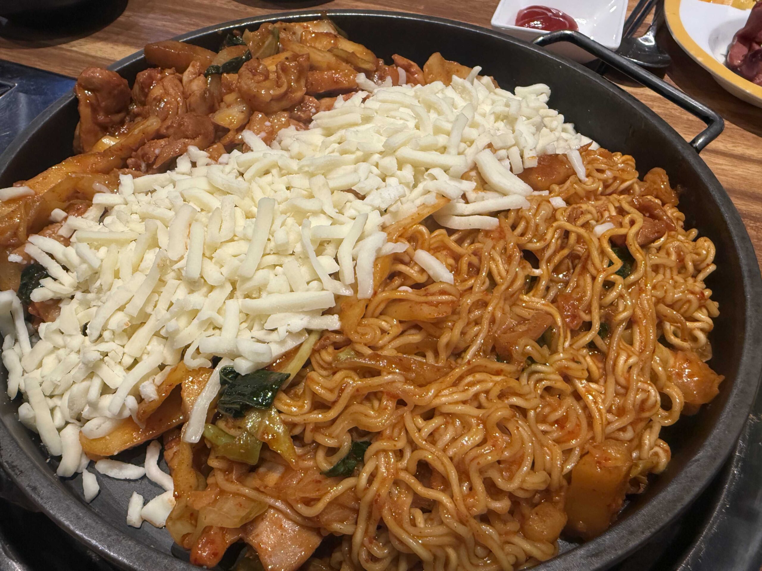 Biwabyul Dakgalbi Wirye cheese dakgalbi set with mozzarella shred and ramen before cooking