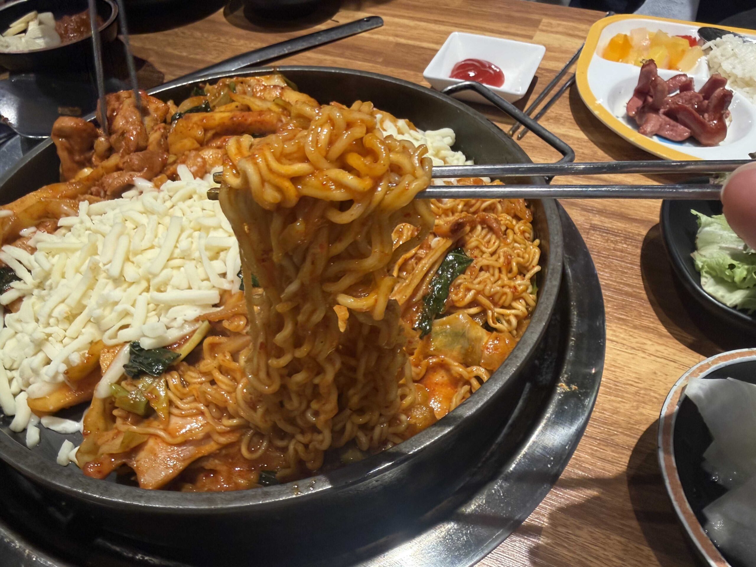 Biwabyul Dakgalbi Wirye ramen noodle lift with cheese dakgalbi
