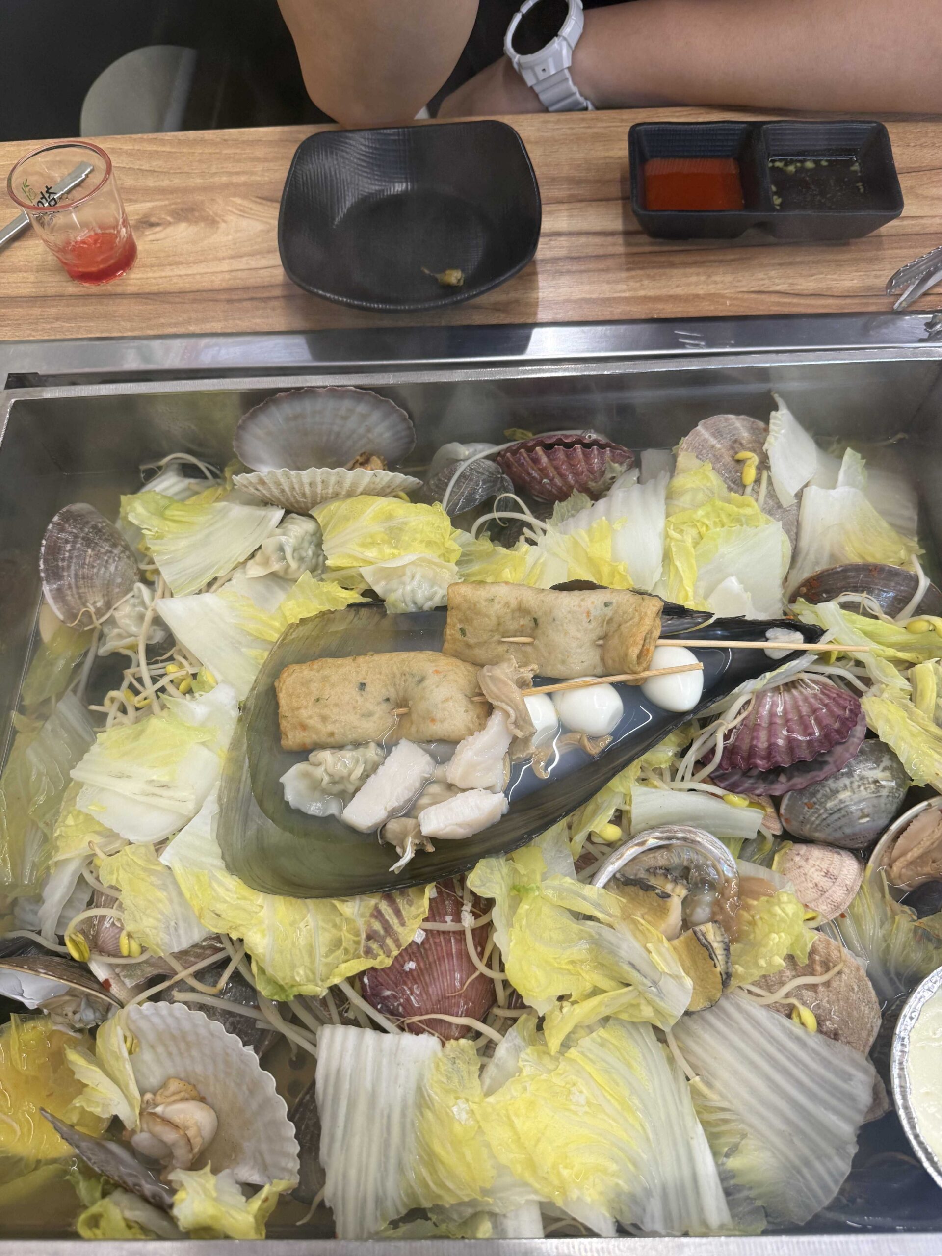 Jjimagi Jamsil Bangi seafood steamer packed with scallops, mussels, and abalone