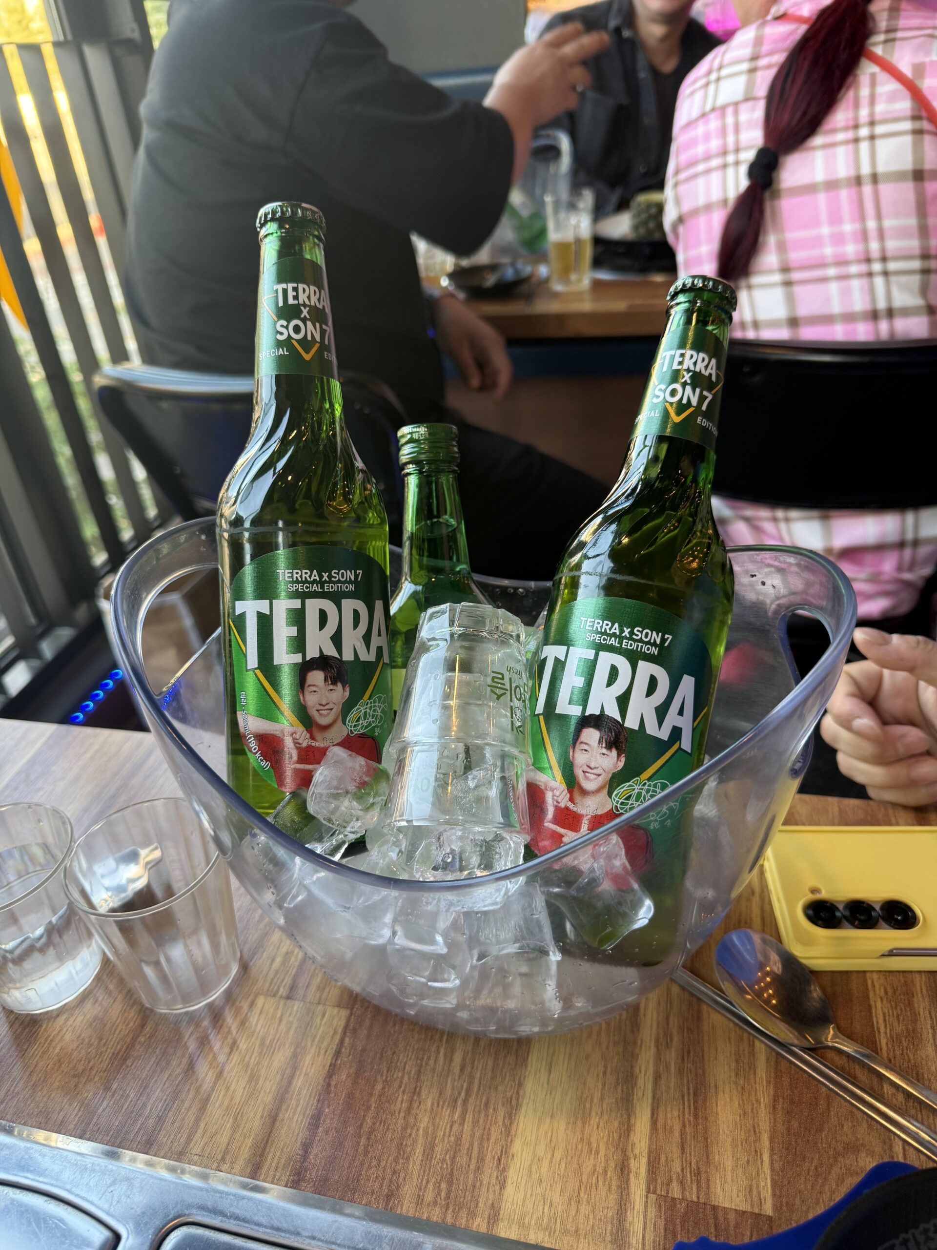 Terra beer bottles in ice bucket at Pocha Cheonguk Hanam Korean somaek
