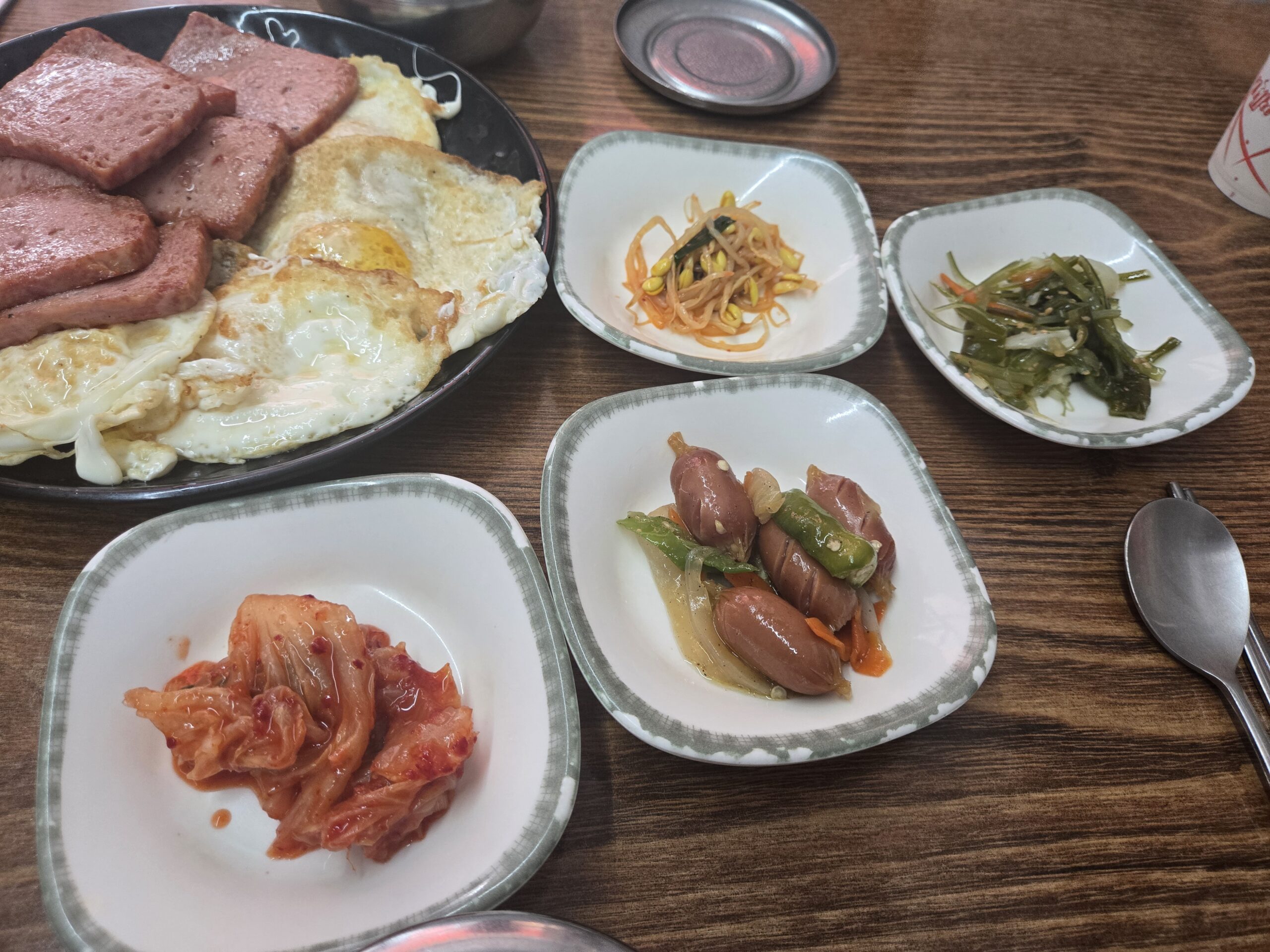 Dalnimine Seongsu banchan with kimchi sausage stir-fry sprouts kale