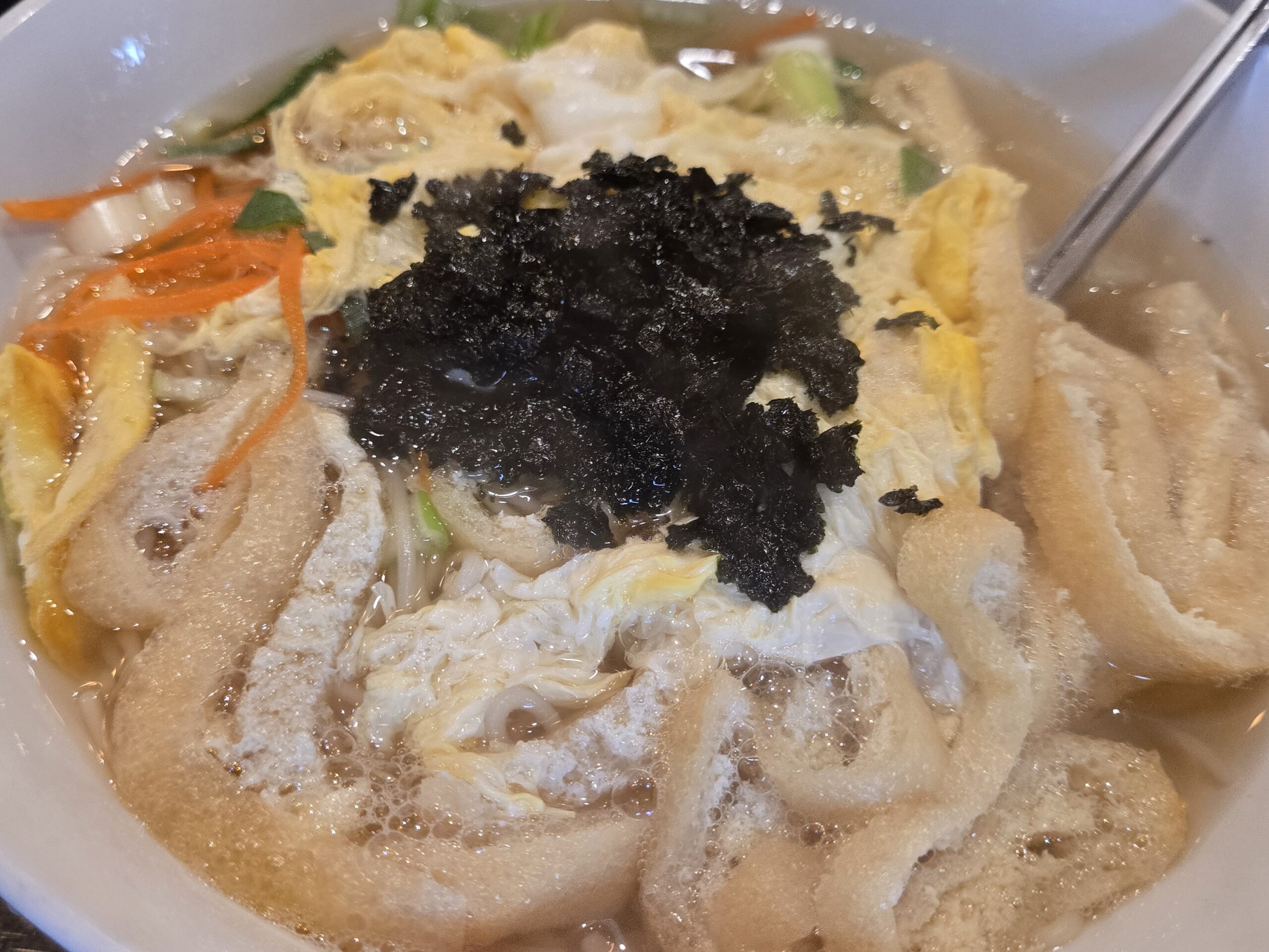 Kalguksu noodle bowl with egg ribbon scallions and seaweed at Jinseong Hanu Gopchang