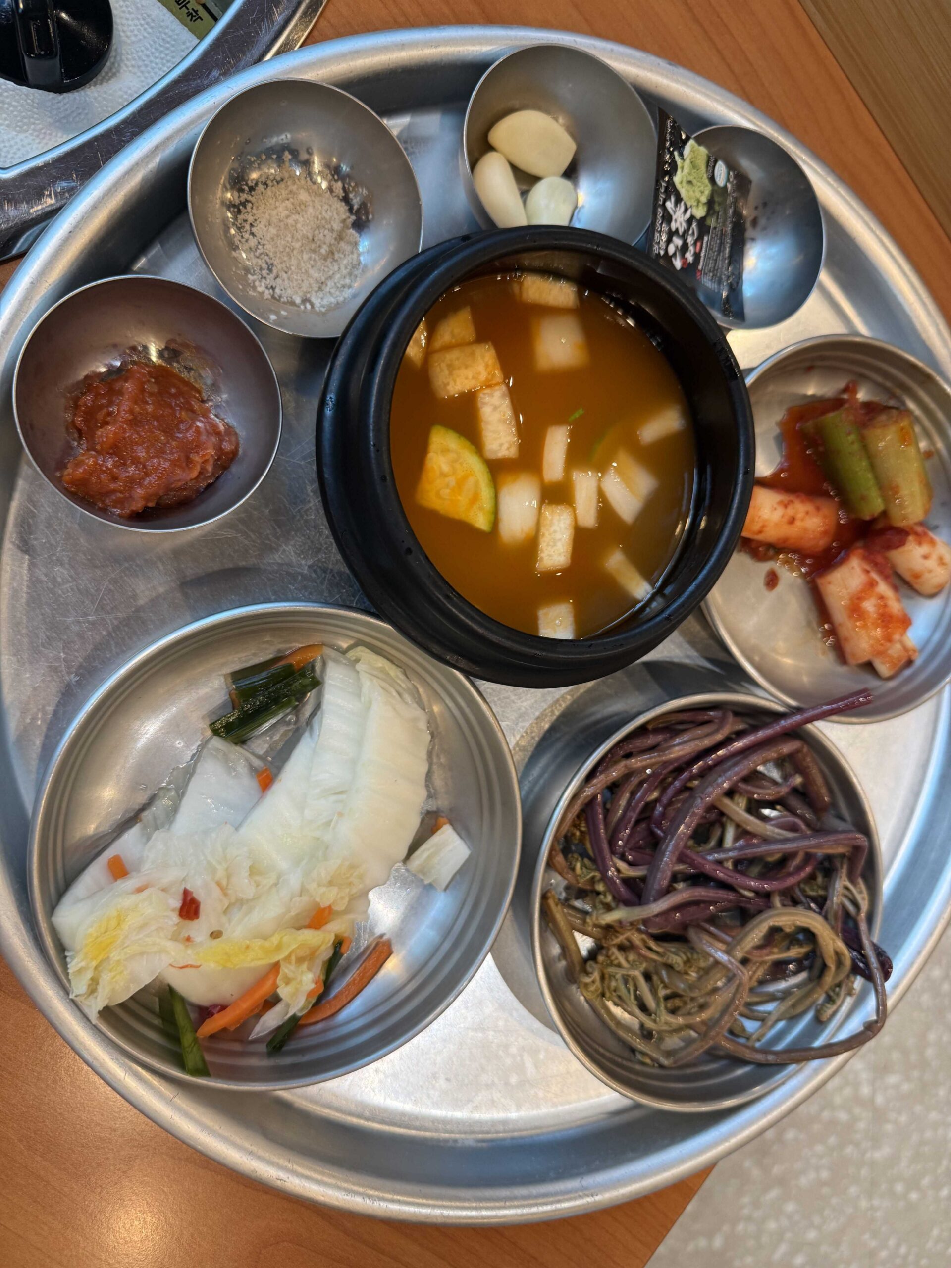 Banchan tray with doenjang stew and sides at Sottukkeong Samgyeopsal in Hanam