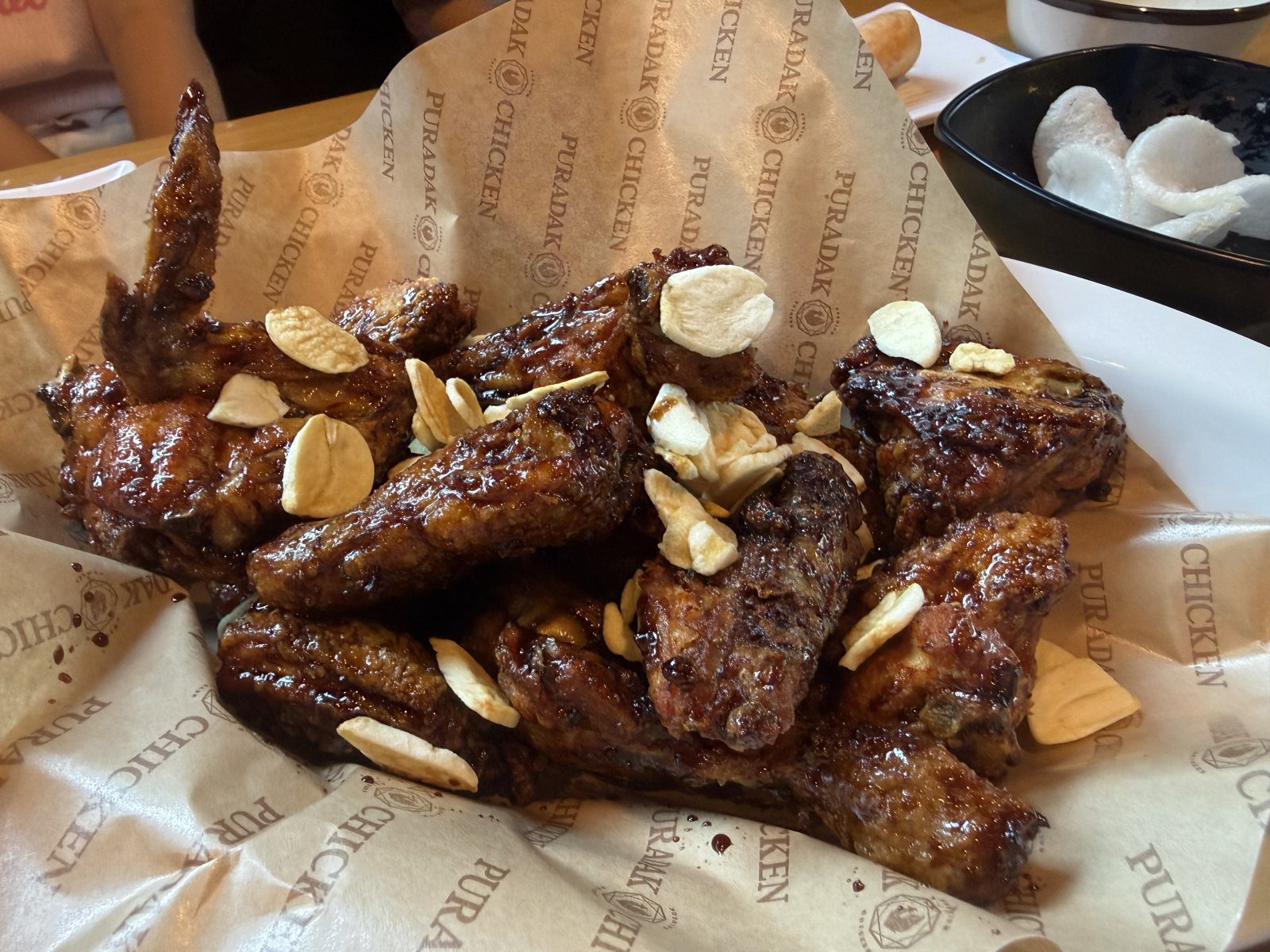 Puradak chicken yangnyeom close up with crushed almonds