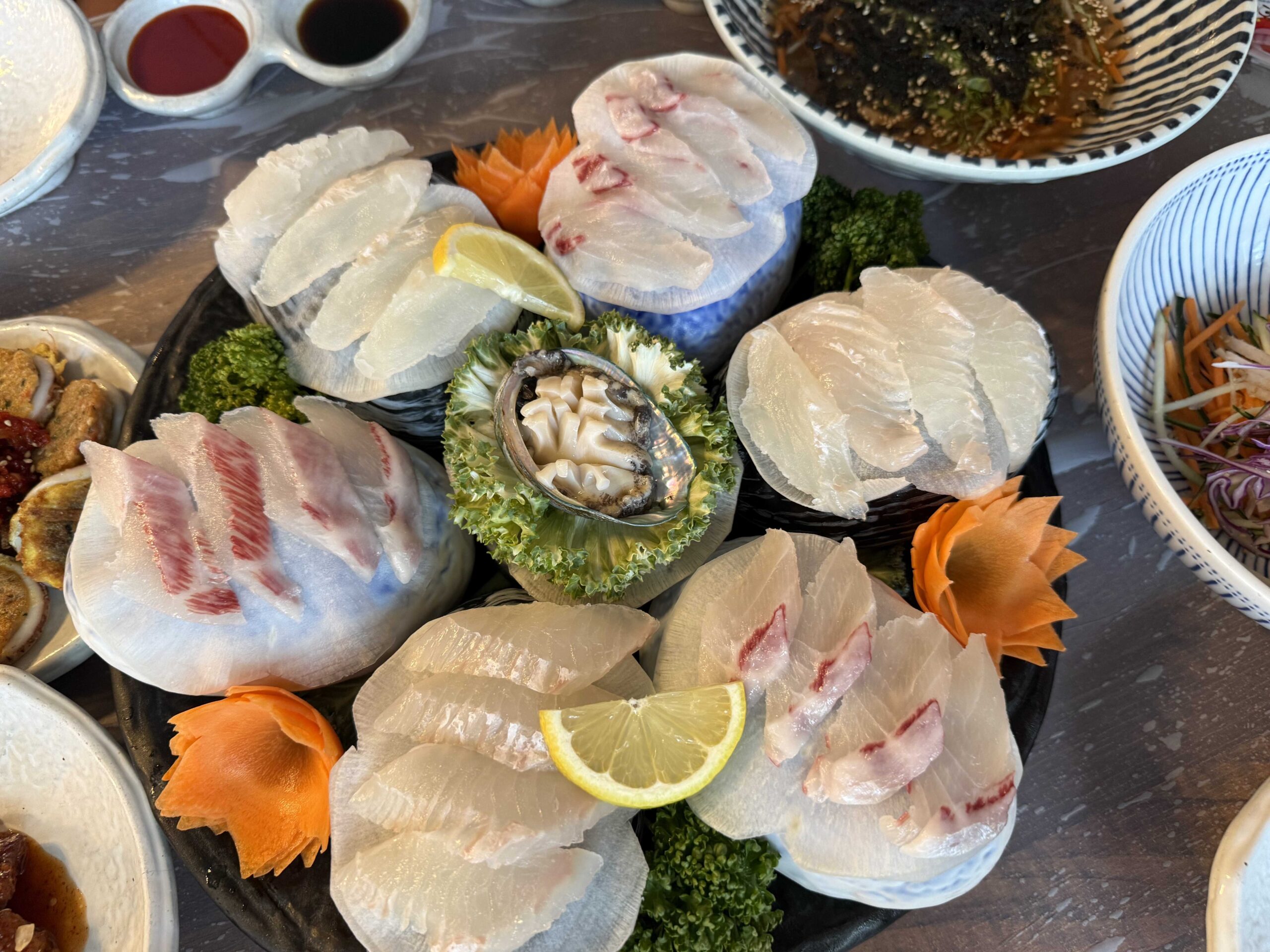 Sashimi platter with abalone served with the Samcheok snow crab set at Boss Daege