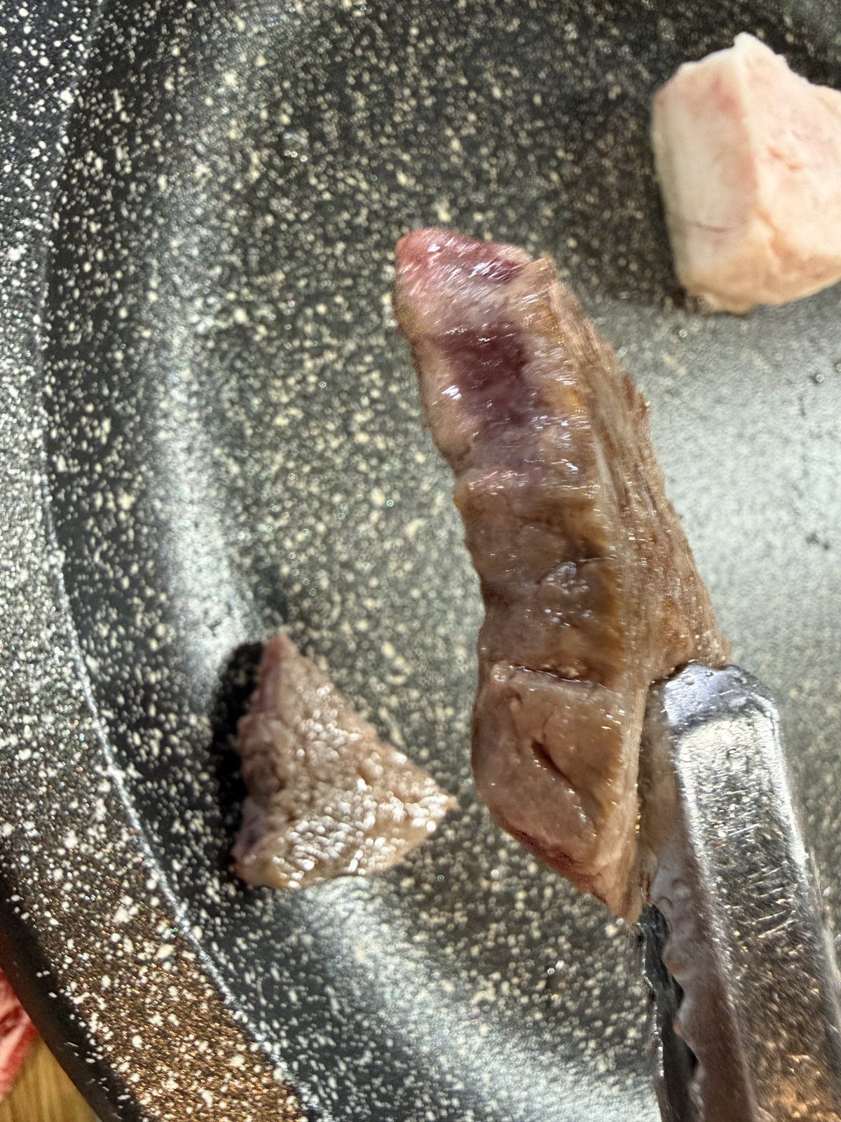 Beef searing on the grill at Tandata Korean BBQ