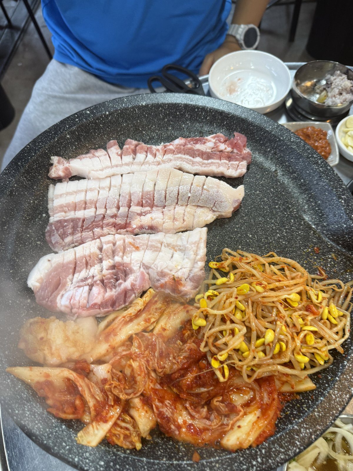 Grilled noodles cooking beside the meat at Tandata Korean BBQ