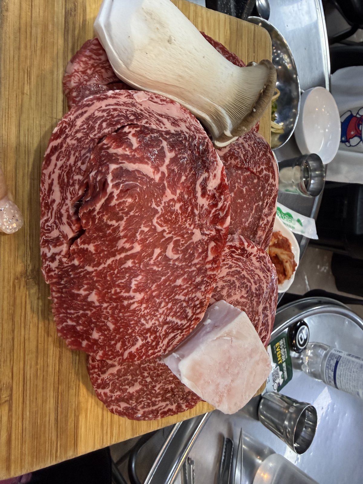 Marbled ribeye raw on the plate at Tandata Korean BBQ