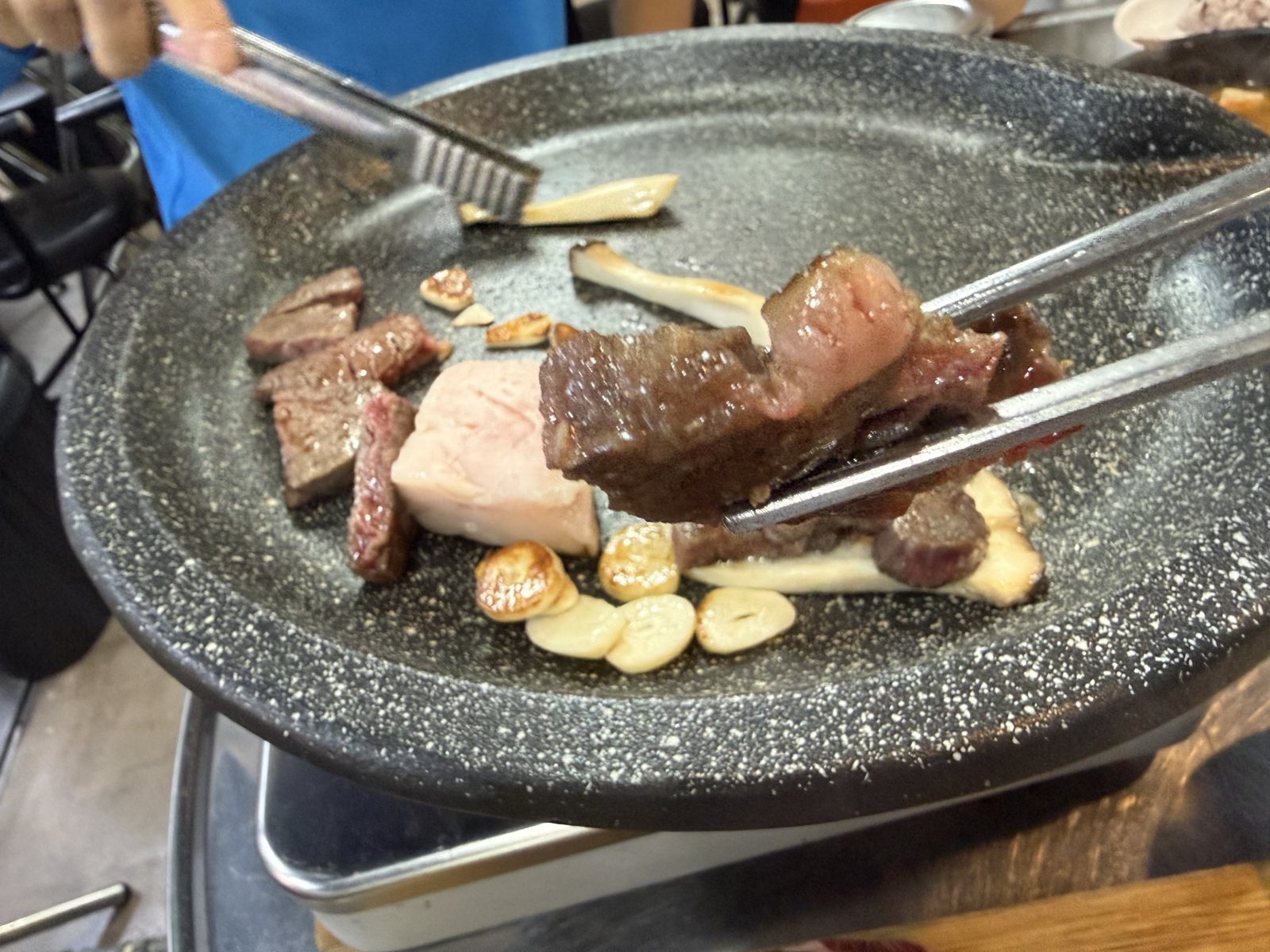 Pork belly on the grill at Tandata Korean BBQ