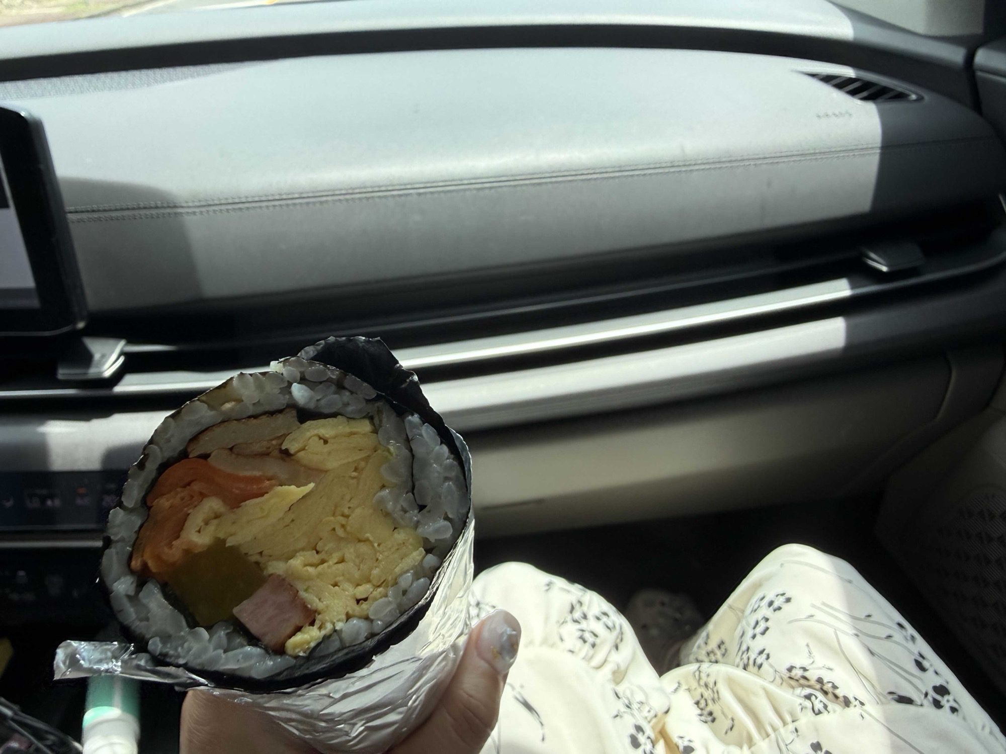 Egg-packed regular Dajeongine Gimbap roll held in the car