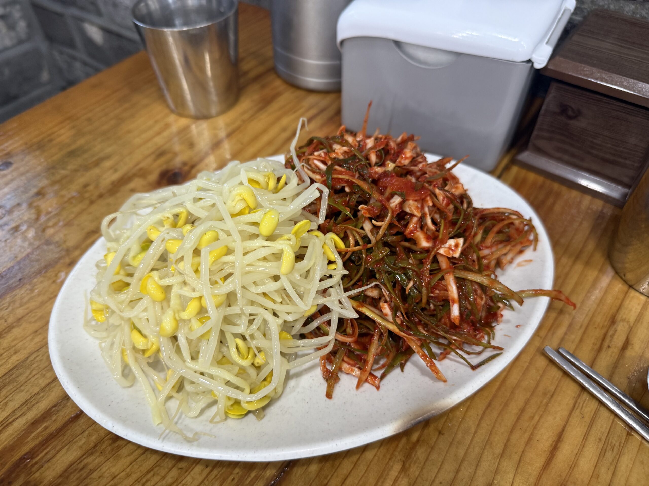 Bean sprouts and spicy radish side dish at Gaseureum Sikdang