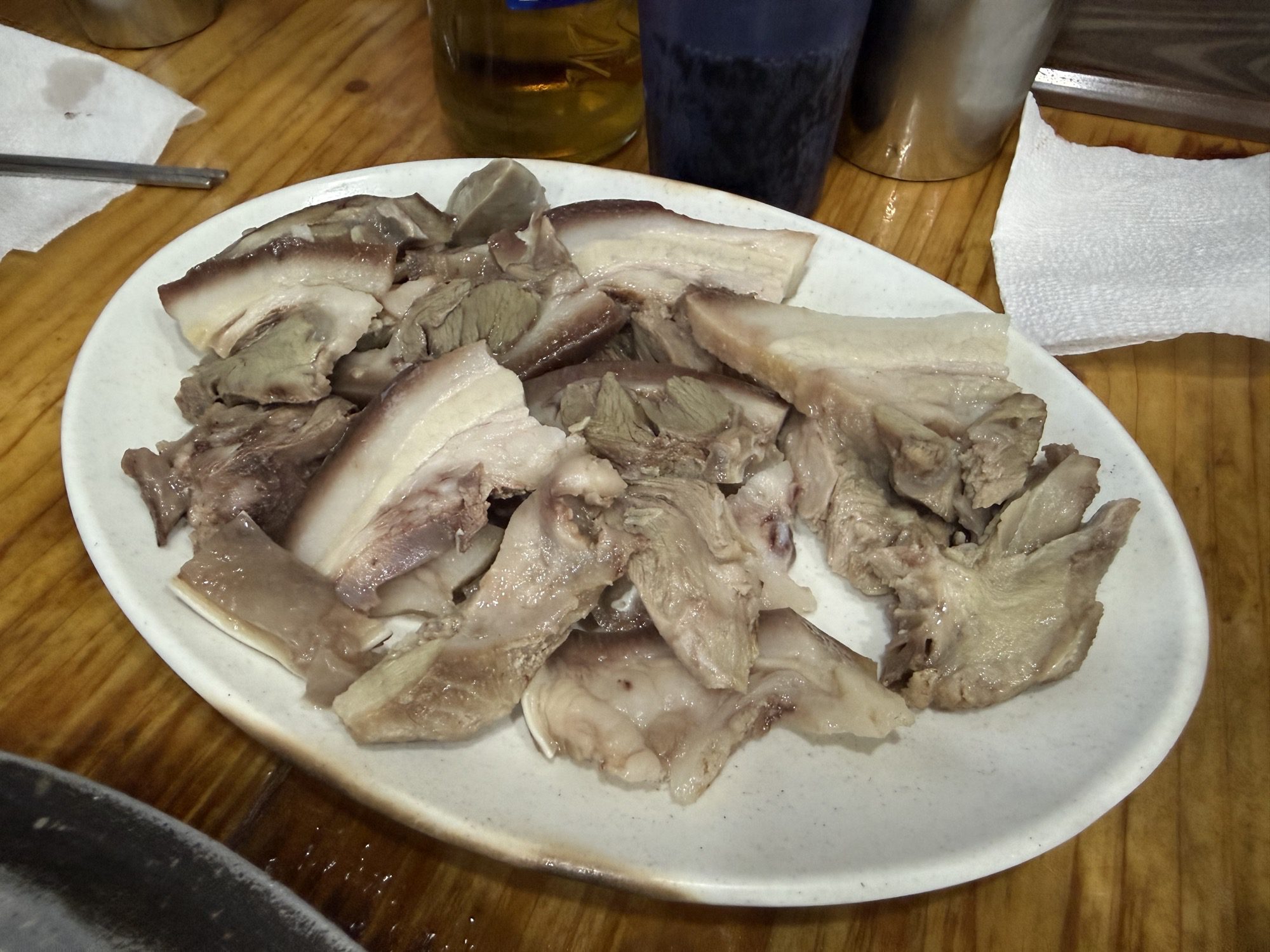 Close-up of tender boiled pork suyuk slices at Gaseureum Sikdang