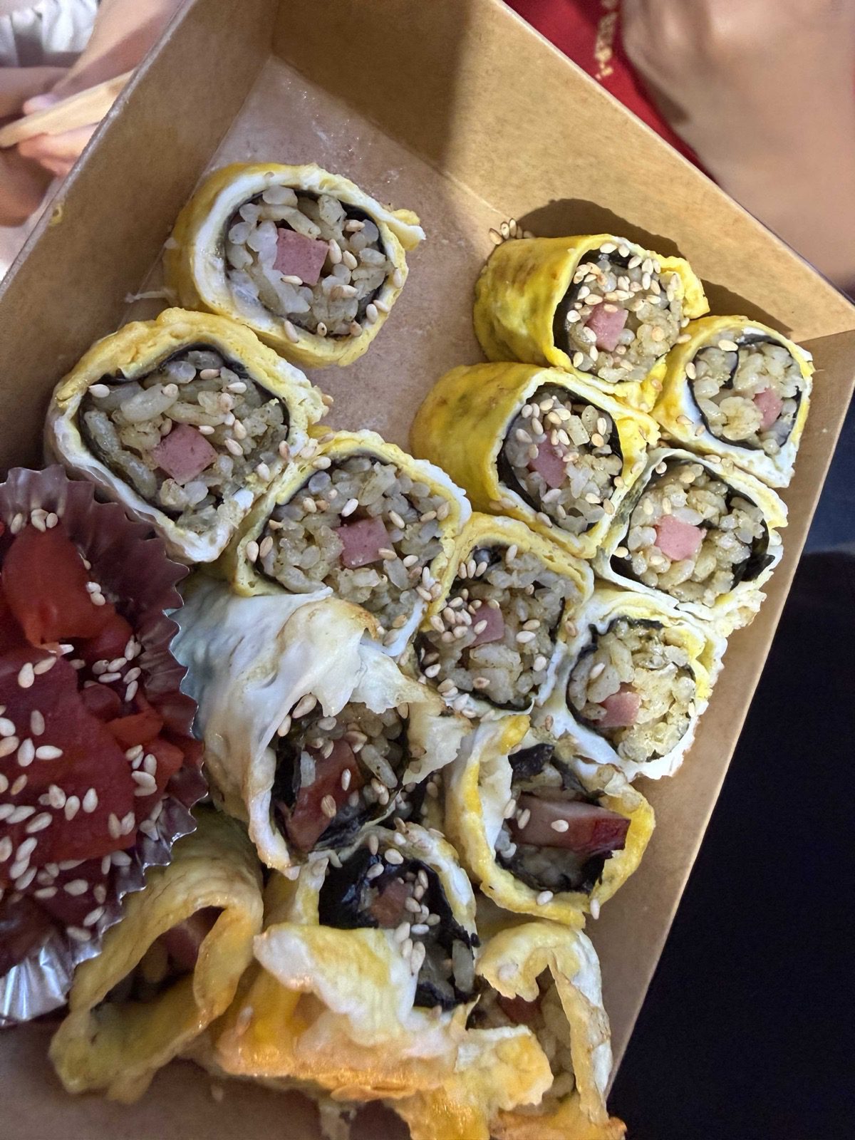 Egg-wrapped gimbap takeout box from Jeju Dongmun Market