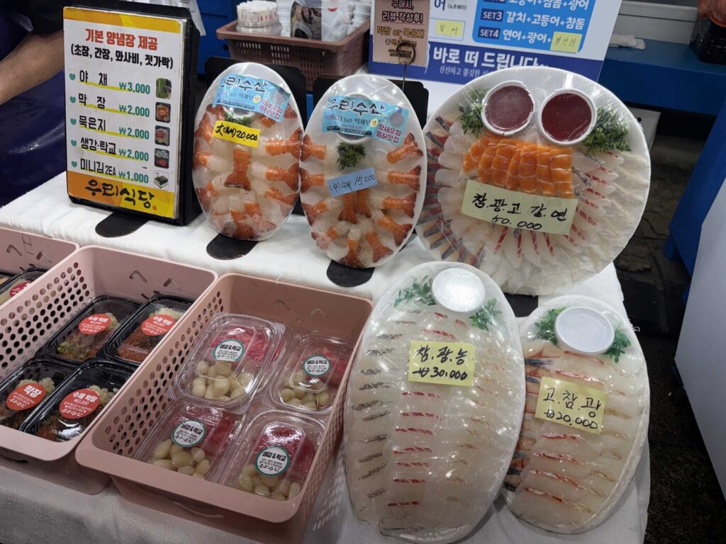 Sashimi packs with prices at a raw fish stall