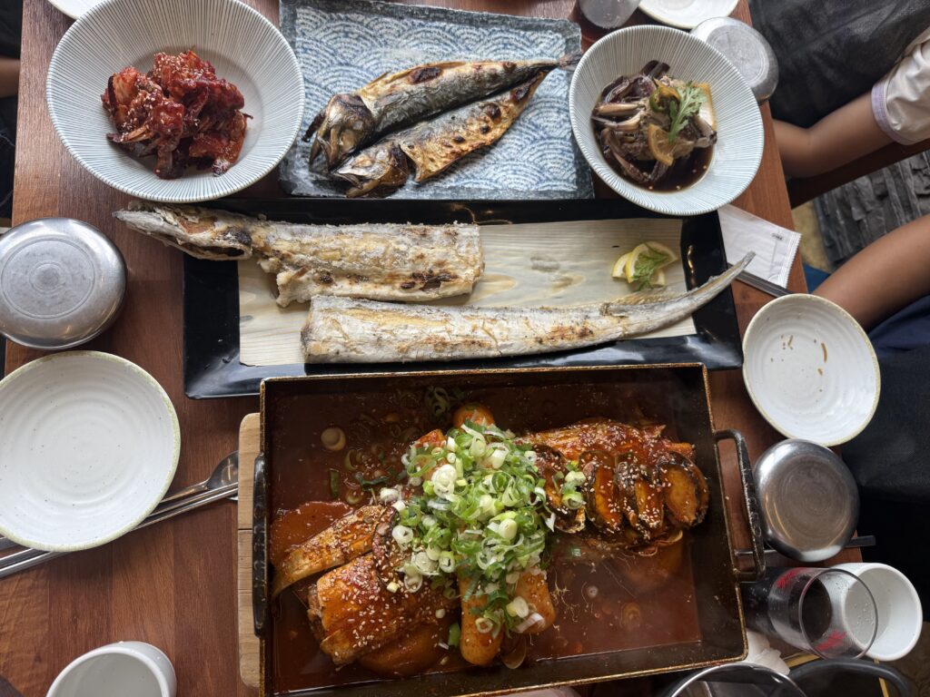 Jeju Gwanghae Aewol galchi jorim and grilled fish spread on the table