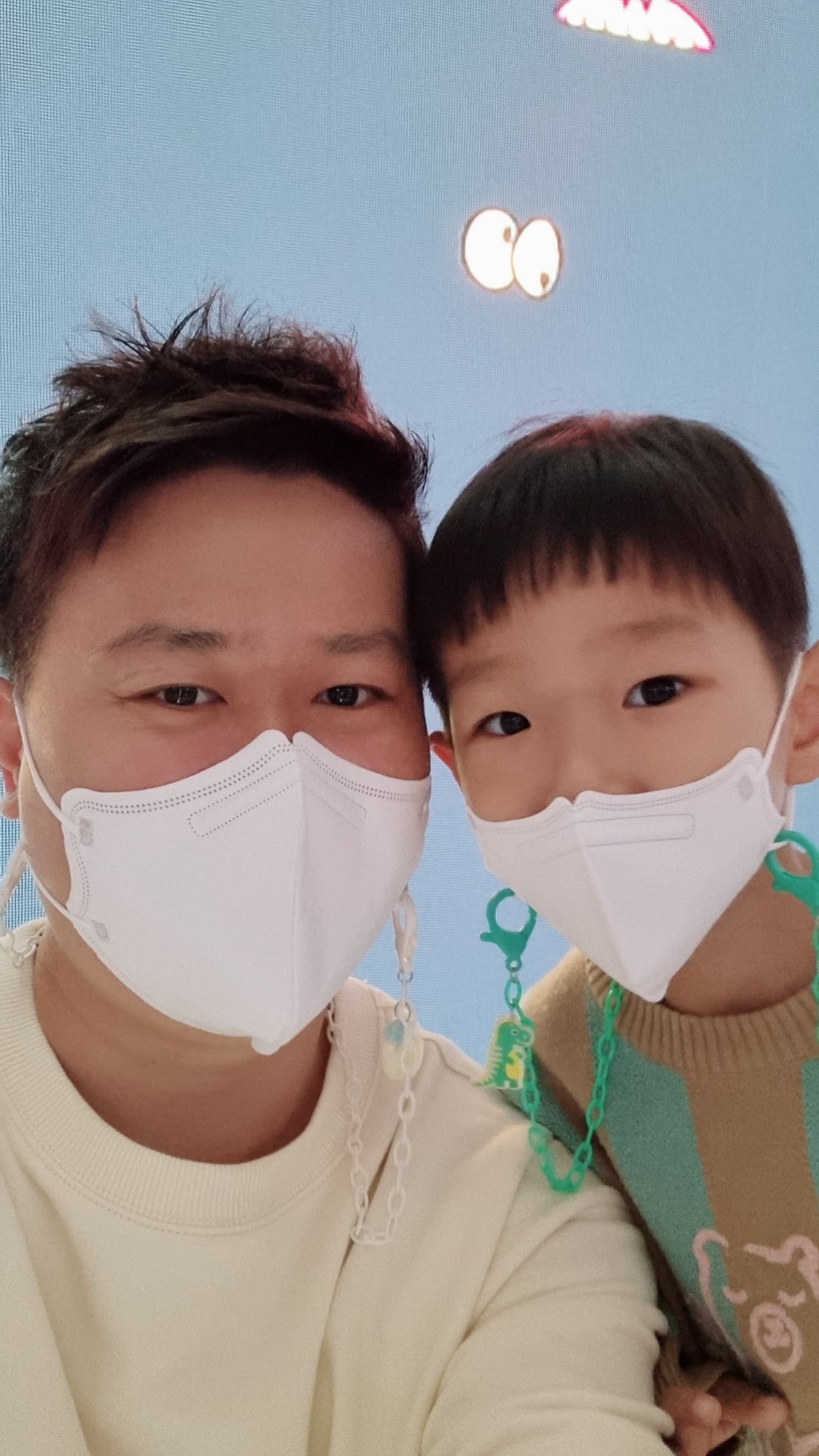Jun of Korea Food Trails with his son on a day out, both in masks